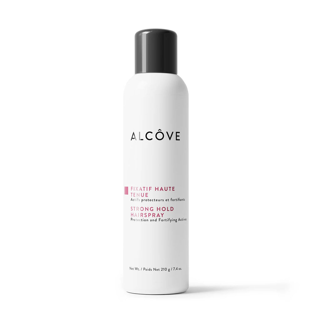 Fixatif haute tenue pour cheveux Alcôve, format 210 g, en vaporisateur blanc avec bouchon noir, vu en gros plan sur fond blanc — coiffant professionnel avec protection UV, anti-frisottis et longue tenue.