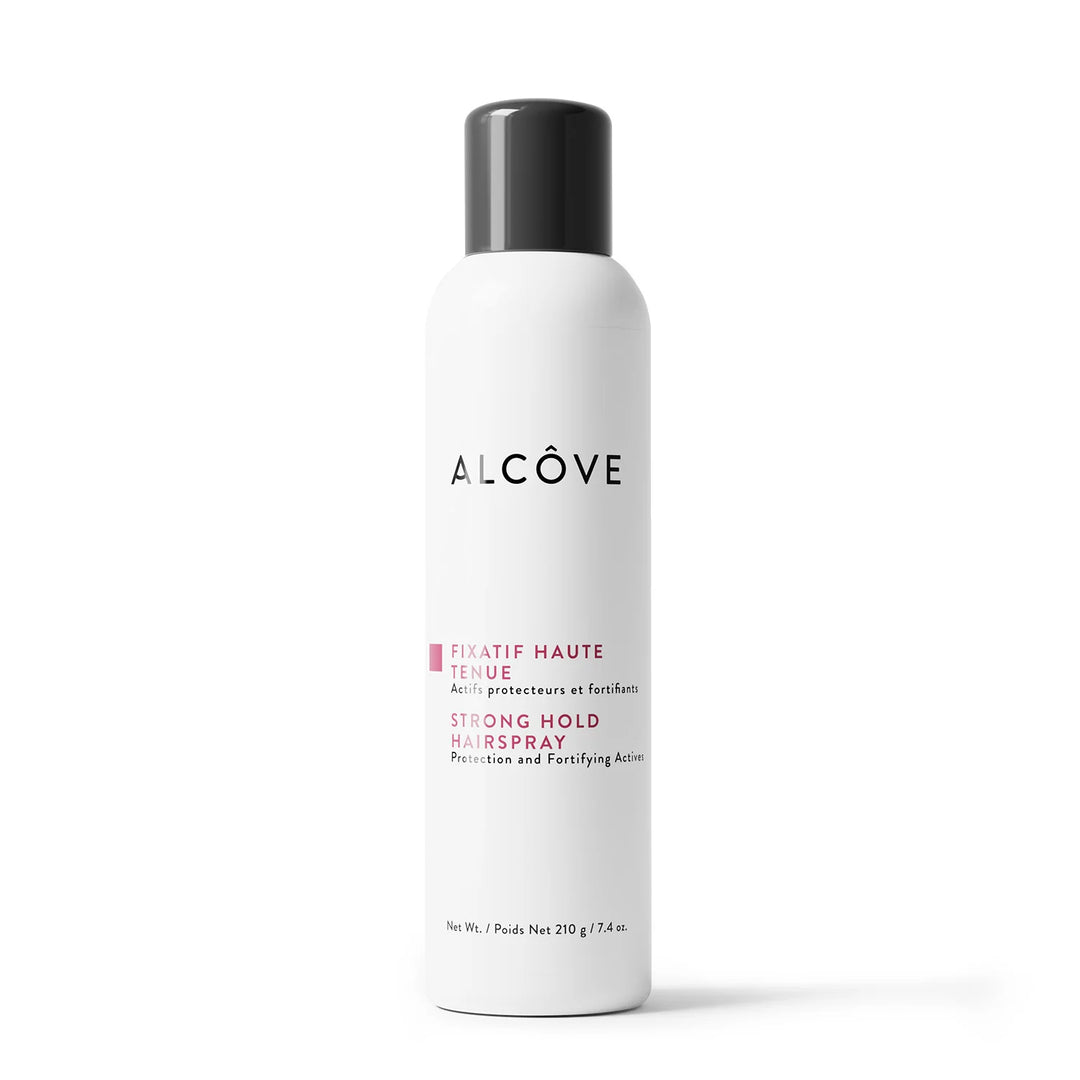 Fixatif haute tenue pour cheveux Alcôve, format 210 g, en vaporisateur blanc avec bouchon noir, vu en gros plan sur fond blanc — coiffant professionnel avec protection UV, anti-frisottis et longue tenue.