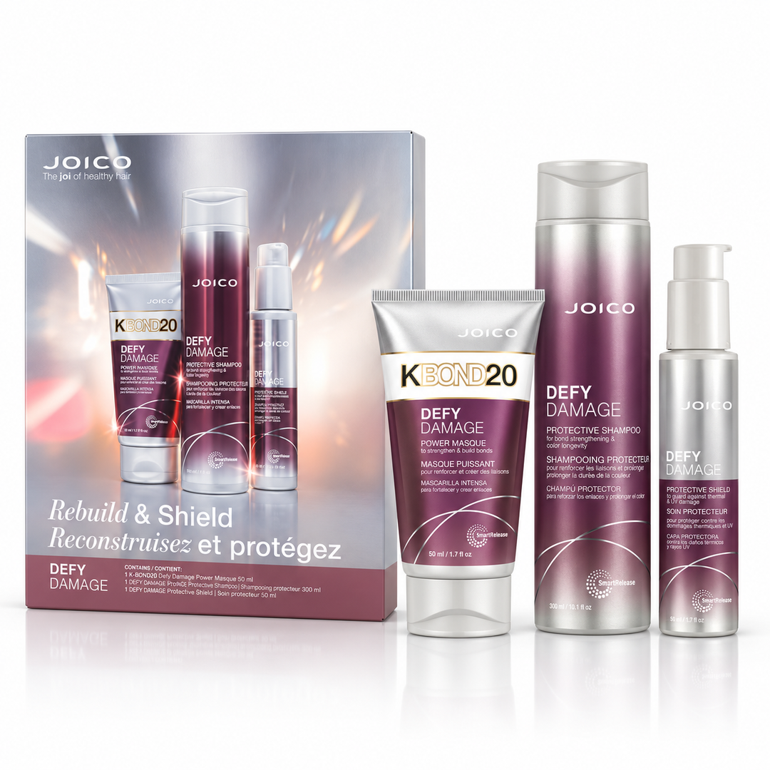 Coffret Joico Defy Damage Reconstruisez et protégez sur fond blanc avec shampoing protecteur 300 ml, masque KBOND20 50 ml et soin Protective Shield 50 ml dans des emballages argentés et violets.