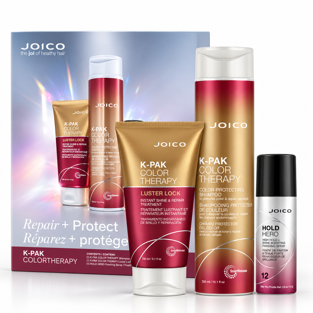 Coffret Joico K-PAK Color Therapy Réparez et protégez présenté sur fond blanc avec boîte cadeau bleu argenté et bordeaux, shampoing protecteur de couleur 300 ml en bouteille dorée et bordeaux, traitement Luster Lock 150 ml en tube doré et bordeaux et fixatif de finition Hold Hero 43 g en aérosol argenté, noir et rose.