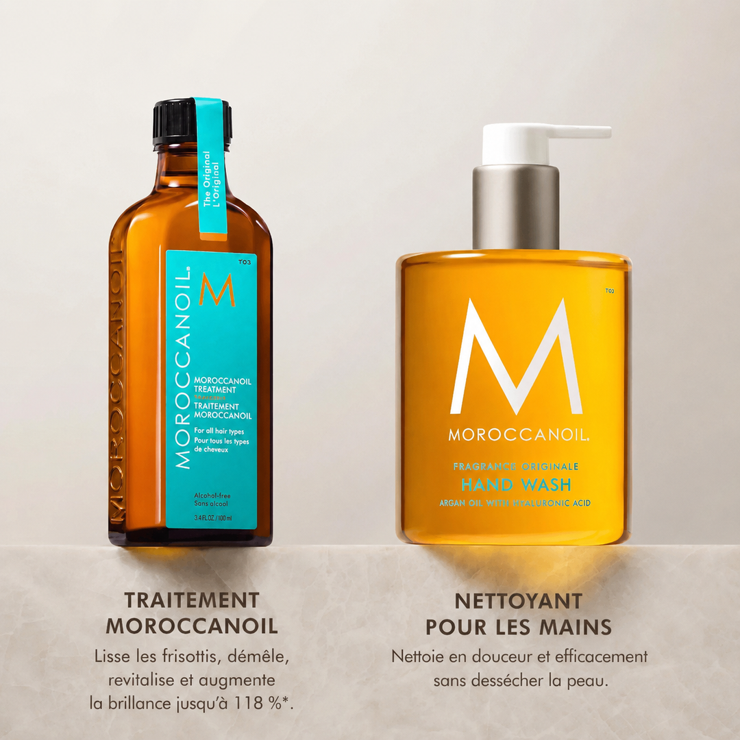 Traitement Moroccanoil original et savon pour les mains Moroccanoil Fragrance Originale en bouteilles ambrées élégantes sur comptoir beige.