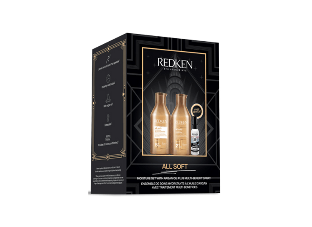Coffret Redken All Soft avec shampoing 300 ml, revitalisant 300 ml et spray One United 30 ml, dans un emballage noir et doré élégant.