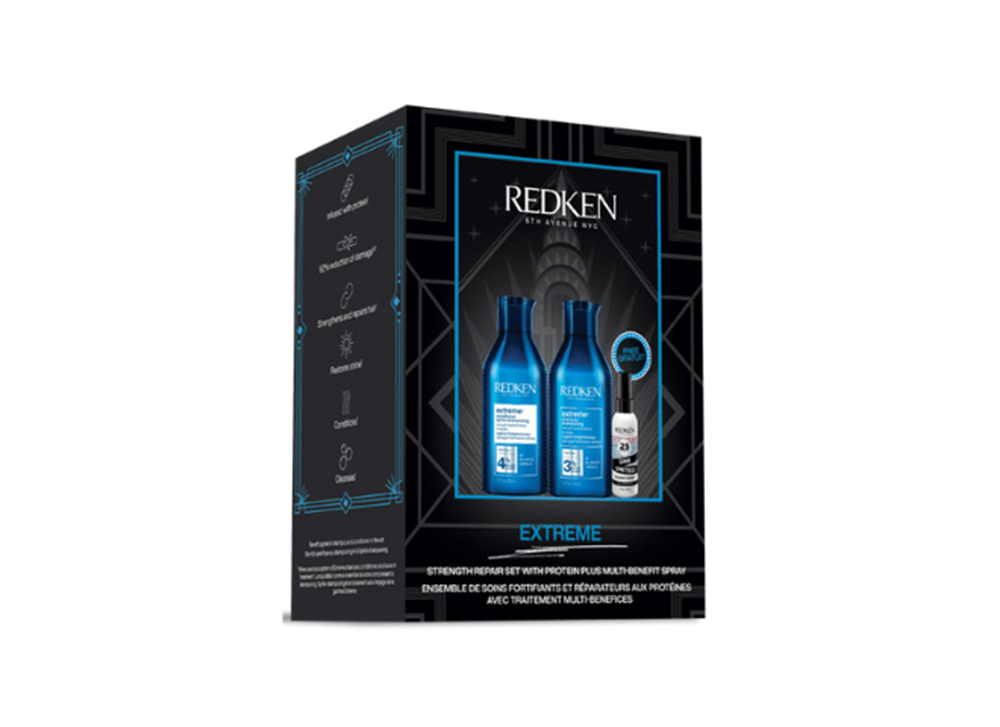 Coffret Redken Extreme avec shampooing 300 ml, revitalisant 300 ml et spray One United 30 ml, dans un emballage bleu foncé à l’allure luxueuse.