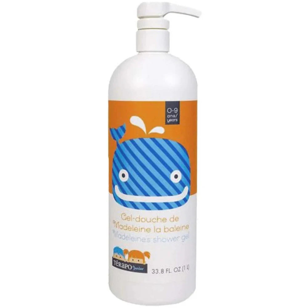 Bouteille de gel-douche pour enfant Térapo Junior, ornée d’une baleine bleue souriante sur fond orange, idéale pour les enfants de 0 à 9 ans.