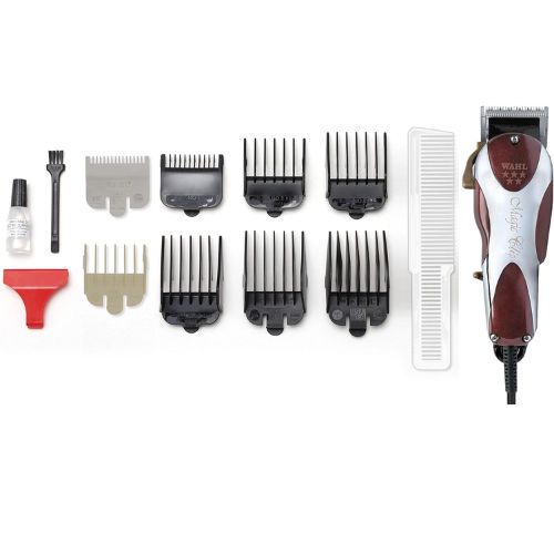 Coffret complet de la tondeuse Wahl Magic Clip filaire : tondeuse, 8 guides de coupe noirs et gris (1/16” à 1”), peigne blanc, huile d’entretien, brosse de nettoyage, protecteur de lame rouge.