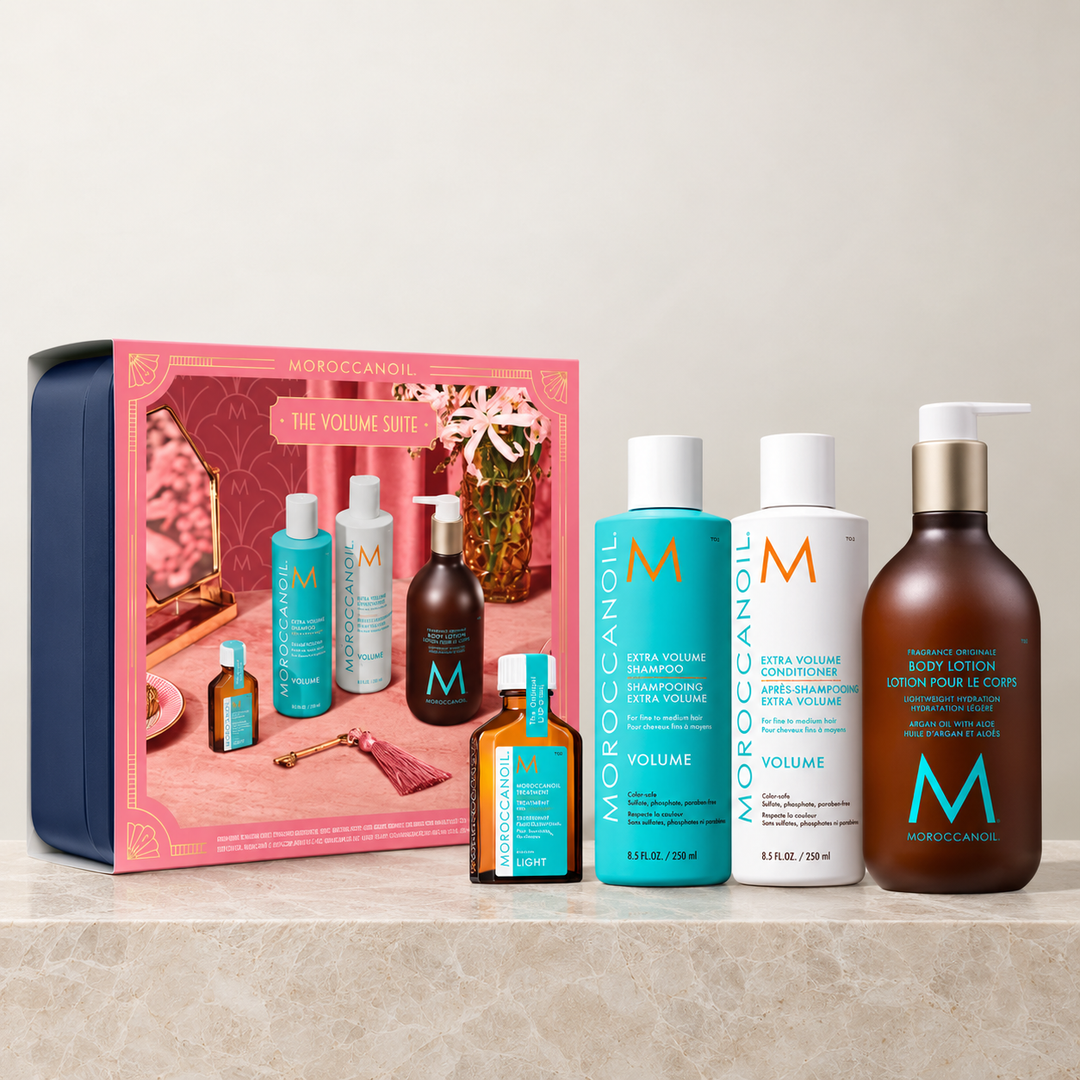 Coffret cadeau rose Moroccanoil The Volume Suite avec shampooing Extra Volume, après-shampooing, Traitement Léger et lotion pour le corps.