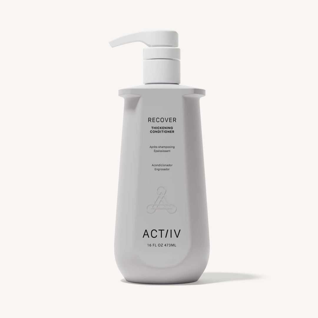 Flacon blanc revitalisant épaississant ACT/IV Recover avec pompe, design minimaliste, format 473 ml, présenté sur fond neutre.