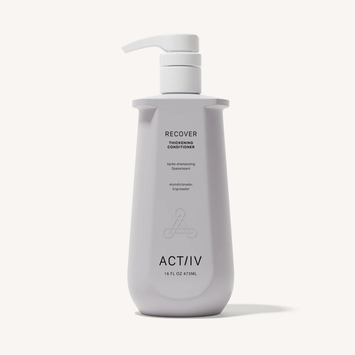 Flacon blanc revitalisant épaississant ACT/IV Recover avec pompe, design minimaliste, format 473 ml, présenté sur fond neutre.