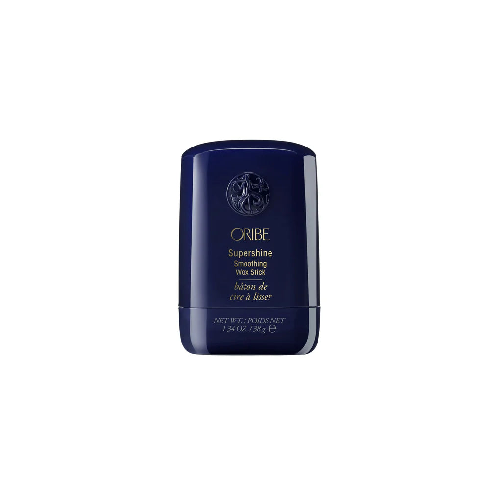 Bâton de cire à lisser ORIBE Supershine bleu marine avec lettrage doré sur fond blanc, format coiffant professionnel anti-frisottis.