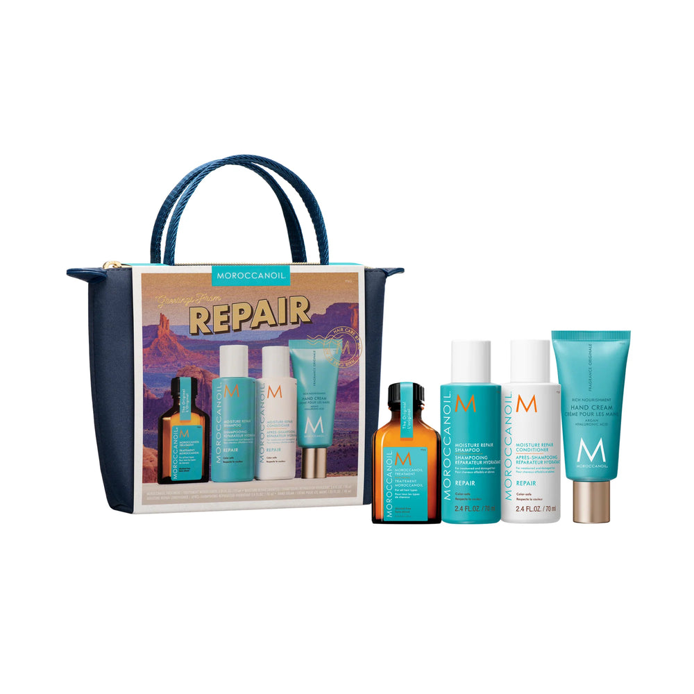 Produits Moroccanoil Repair alignés devant une pochette bleu marin sur fond blanc.