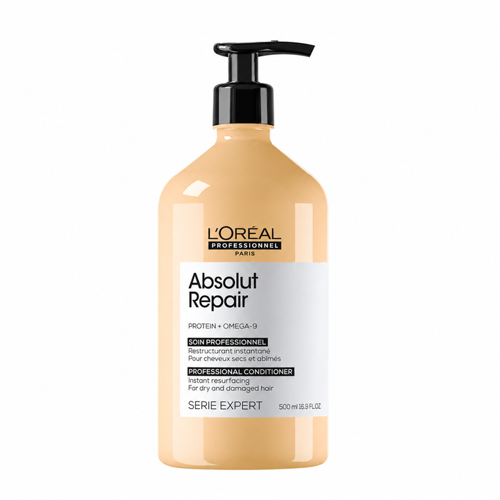 L’ORÉAL Professionnel Absolut Repair soin revitalisant 500 ml pour cheveux secs et abîmés, bouteille beige doré avec pompe noire sur fond blanc.