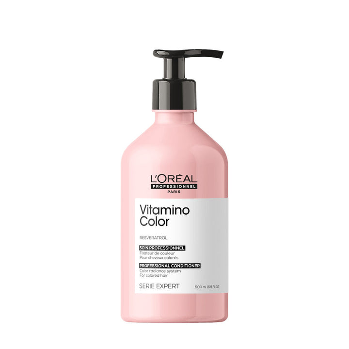 L’ORÉAL Professionnel Vitamino Color revitalisant 500 ml au resvératrol pour cheveux colorés, flacon rose avec pompe noire sur fond blanc.