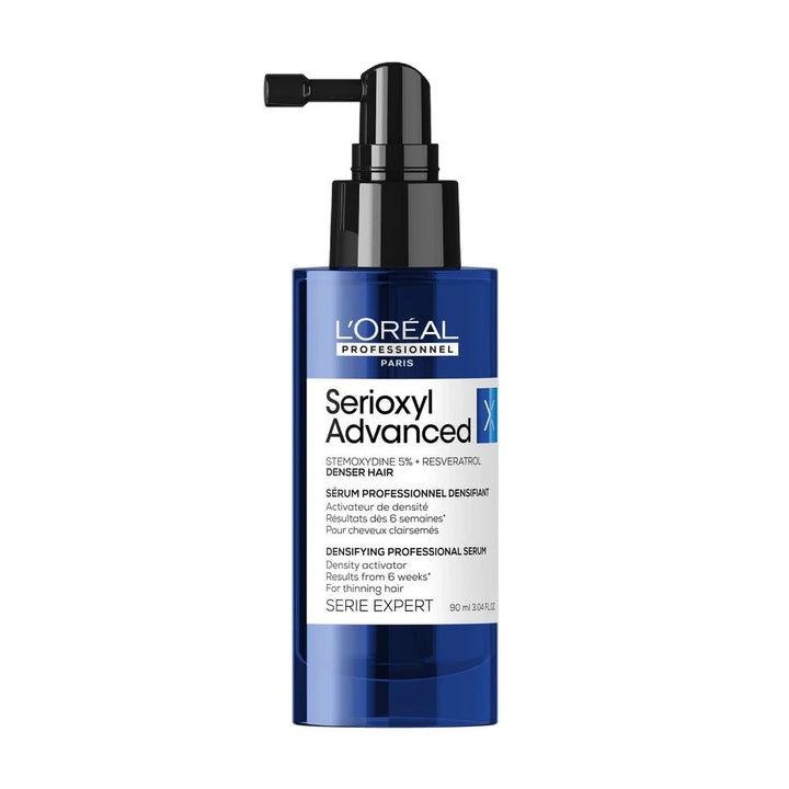 L’Oréal Professionnel Serioxyl Advanced Denser Hair 90 ml, sérum densifiant pour cheveux clairsemés en flacon bleu avec pompe noire sur fond blanc.