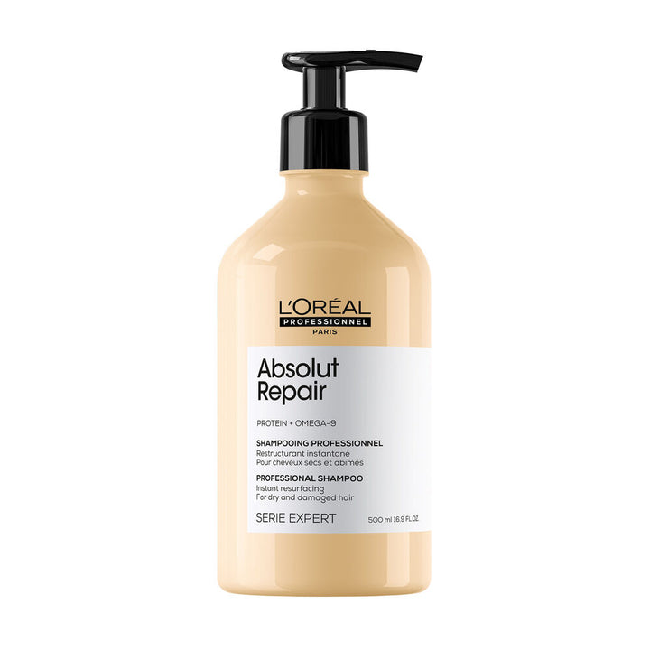 Shampoing L’ORÉAL Professionnel Absolut Repair 500 ml pour cheveux secs et abîmés, bouteille beige doré avec pompe noire sur fond blanc.