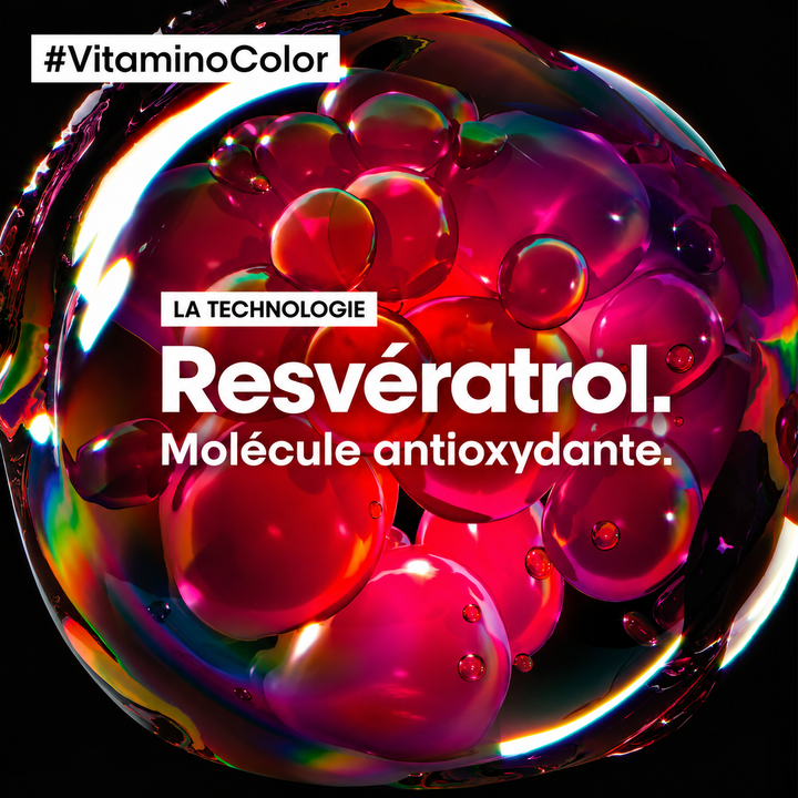 Technologie au resvératrol antioxydant de L’Oréal Professionnel Vitamino Color, illustrée par des molécules rouges et roses sur fond noir.